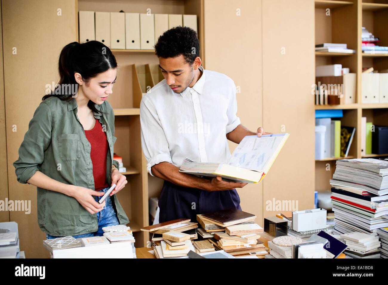 Designers having discussion on samples hi-res stock photography and