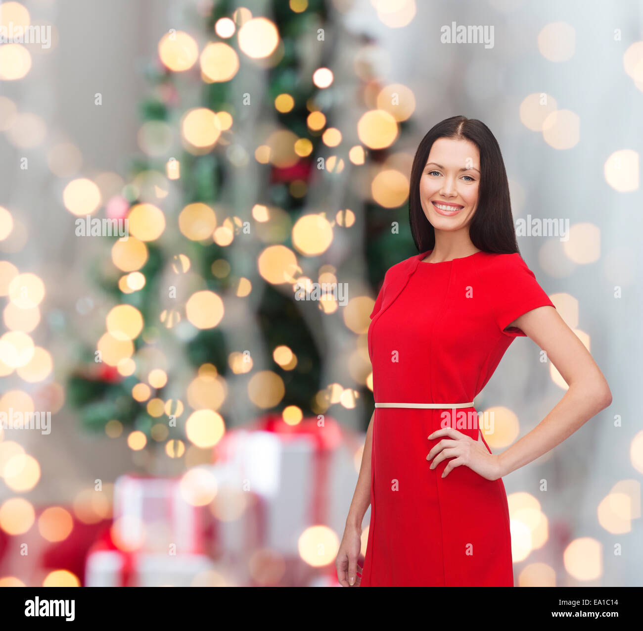 smiling woman in red dress Stock Photo - Alamy