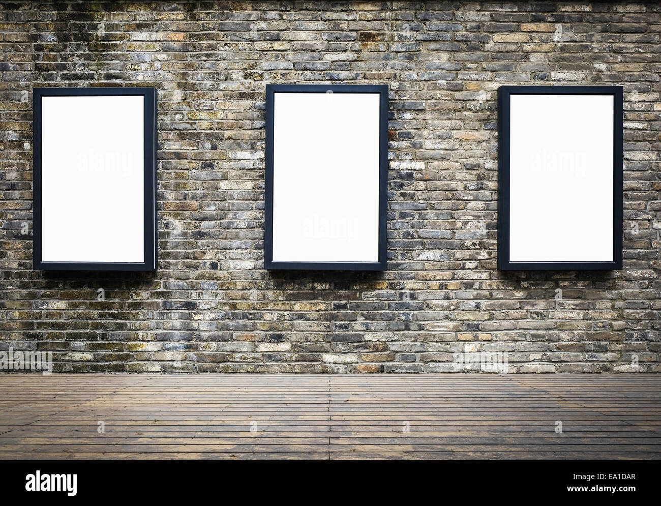 advertising billboard in the old brick wall Stock Photo