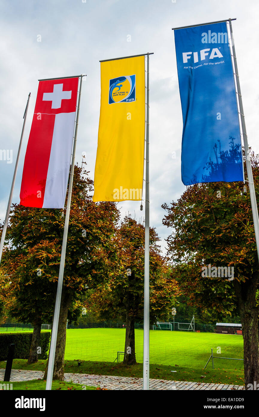 Flags flying at the entrance to the headquarters of FIFA in Zurich, Switzerland Stock Photo