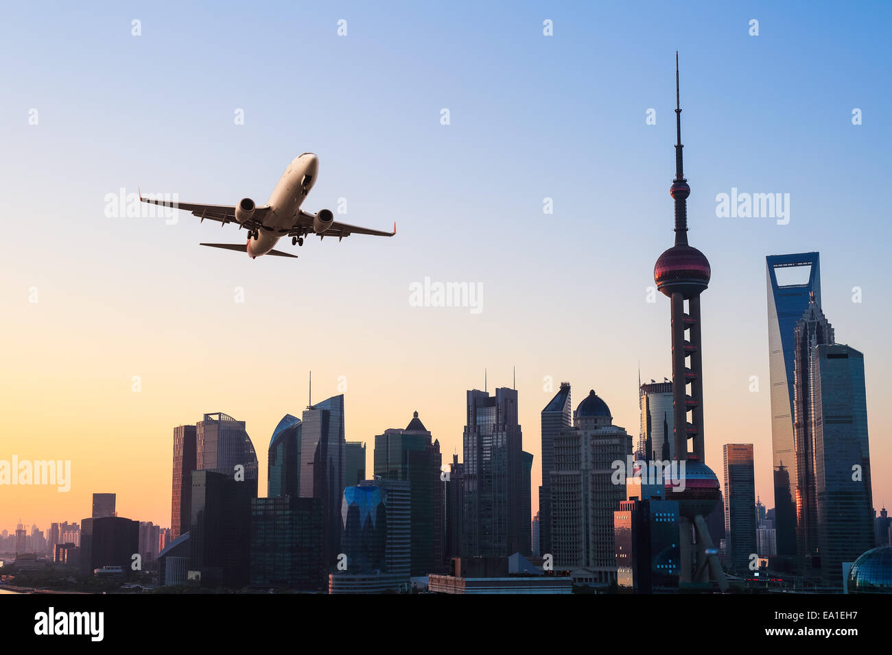 modern city skyline with airplane Stock Photo