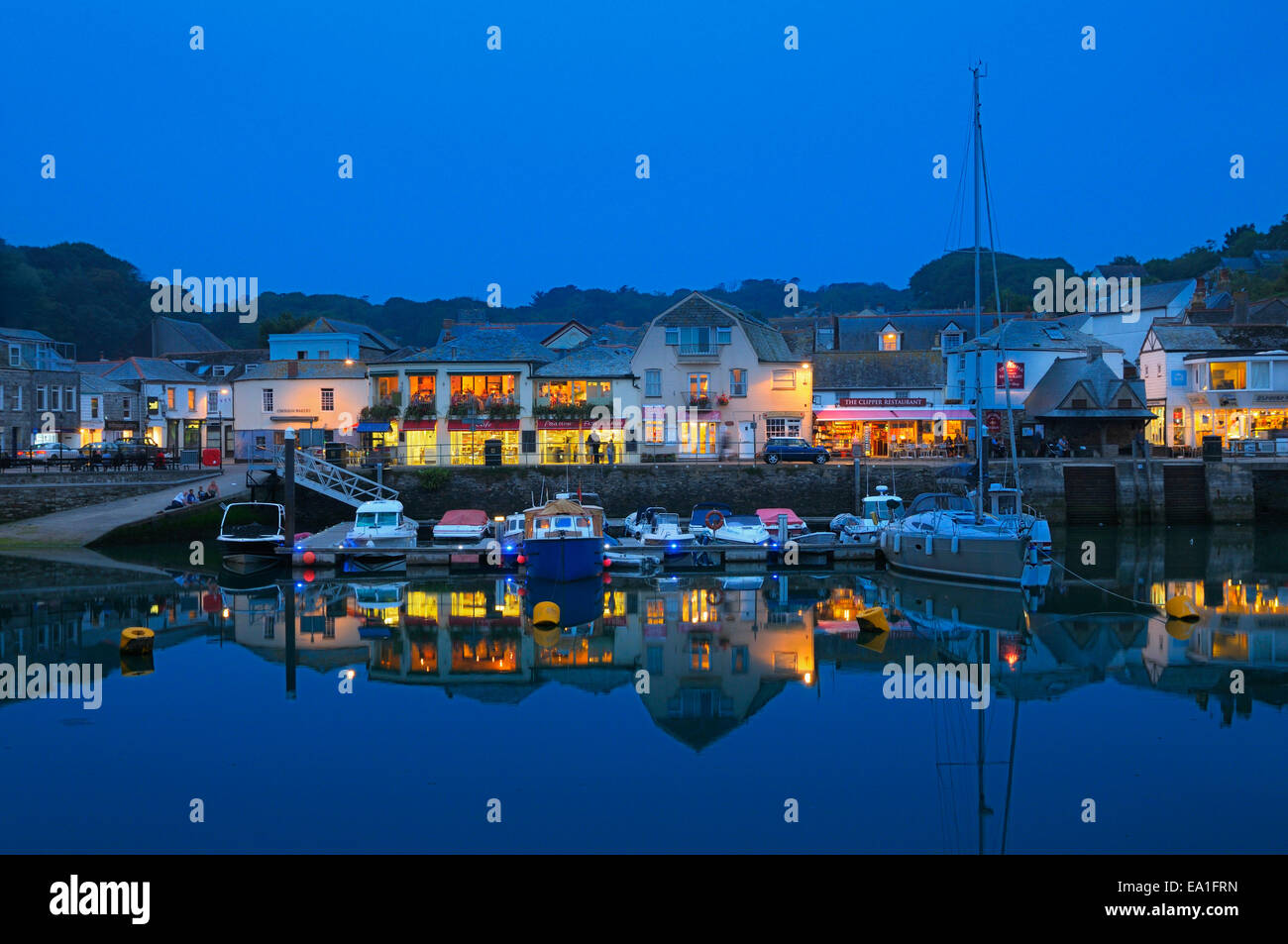 Padstow harbour and village at dusk, Cornwall, UK Stock Photo