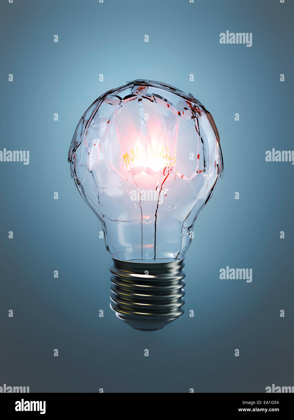 A shattered light bulb what is illuminated  and on household lighting Stock Photo