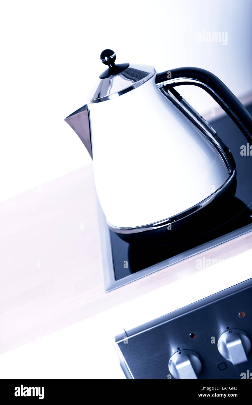 modern electric kettle on cooktop Stock Photo Alamy