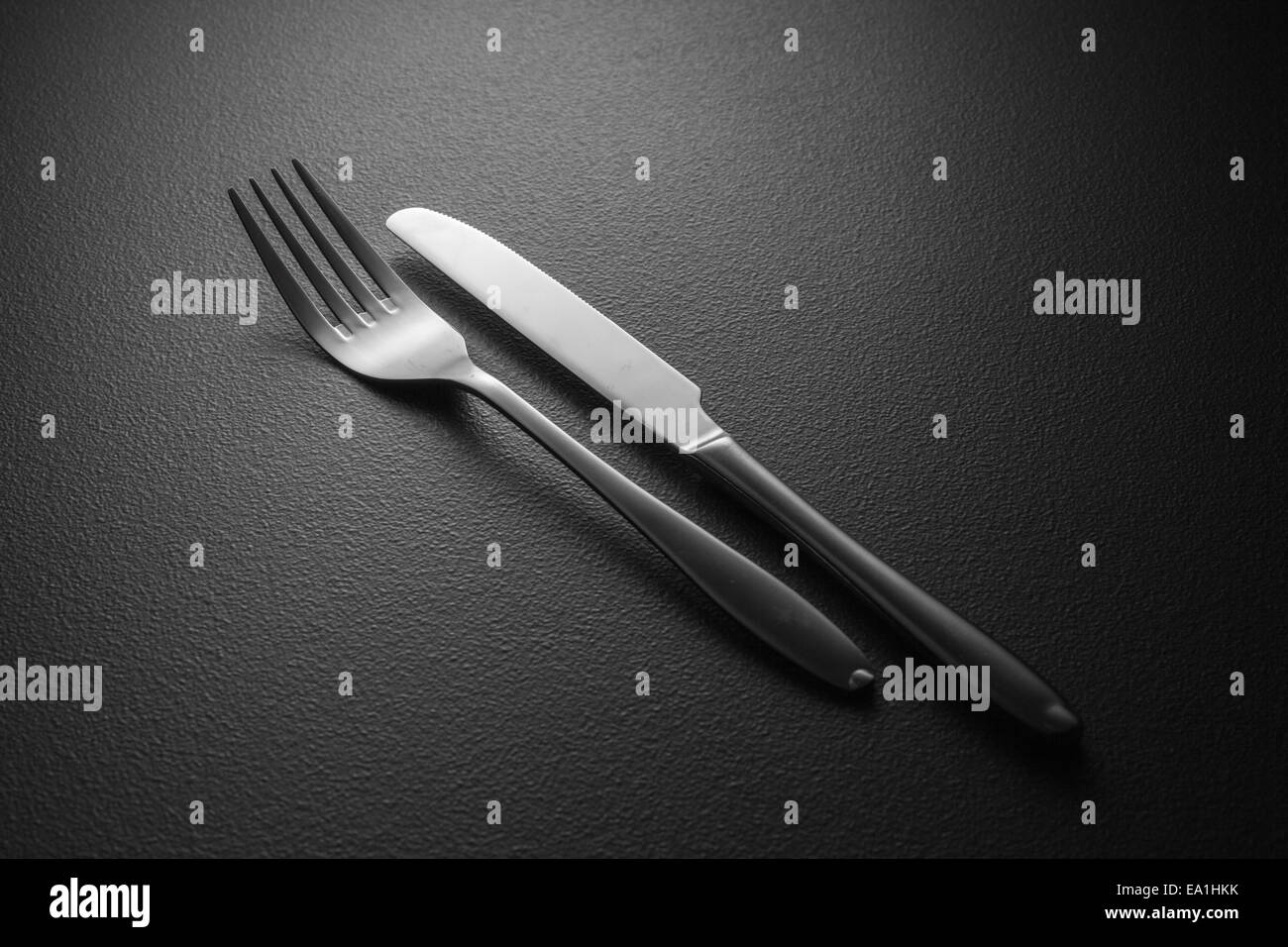 knife and fork on black Stock Photo Alamy
