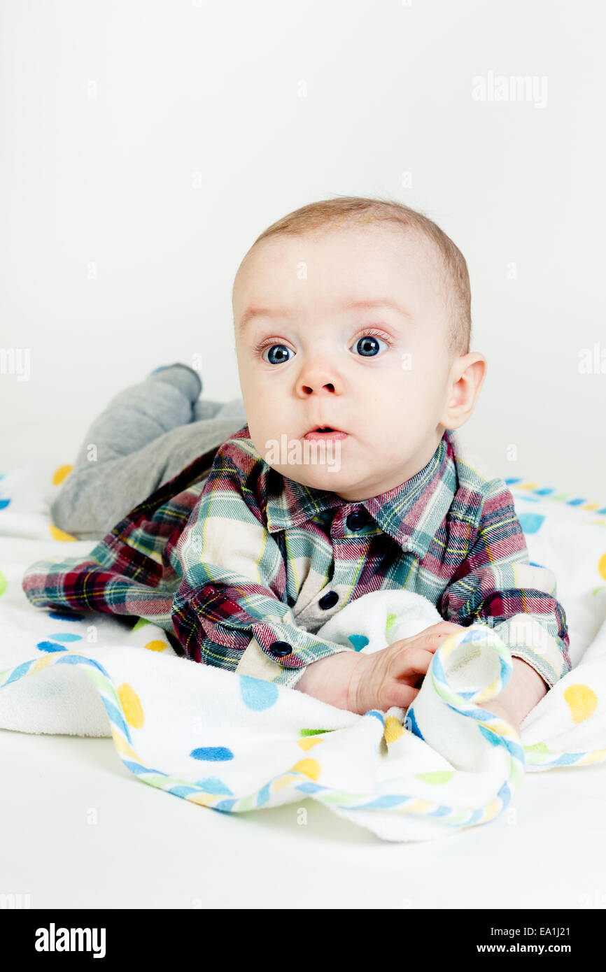 Eyed astonished baby Stock Photo
