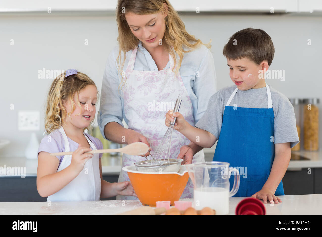 Children and mother baking cookies Stock Photo