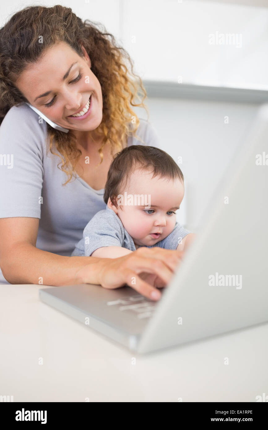 Woman Multitasking Home Woman multi tasking at home Stock Photo - Alamy