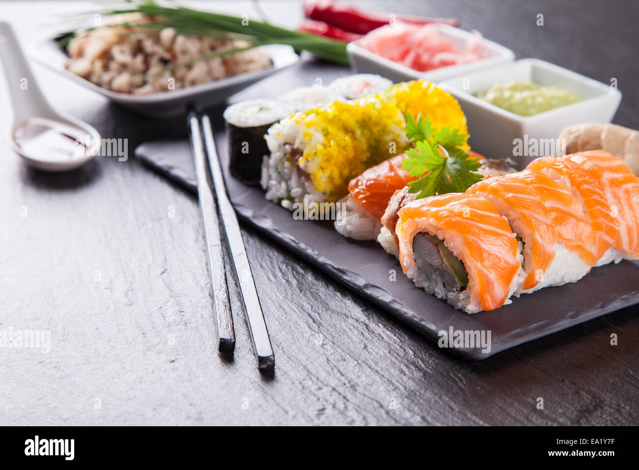 Various kinds of sushi food served on black stone Stock Photo
