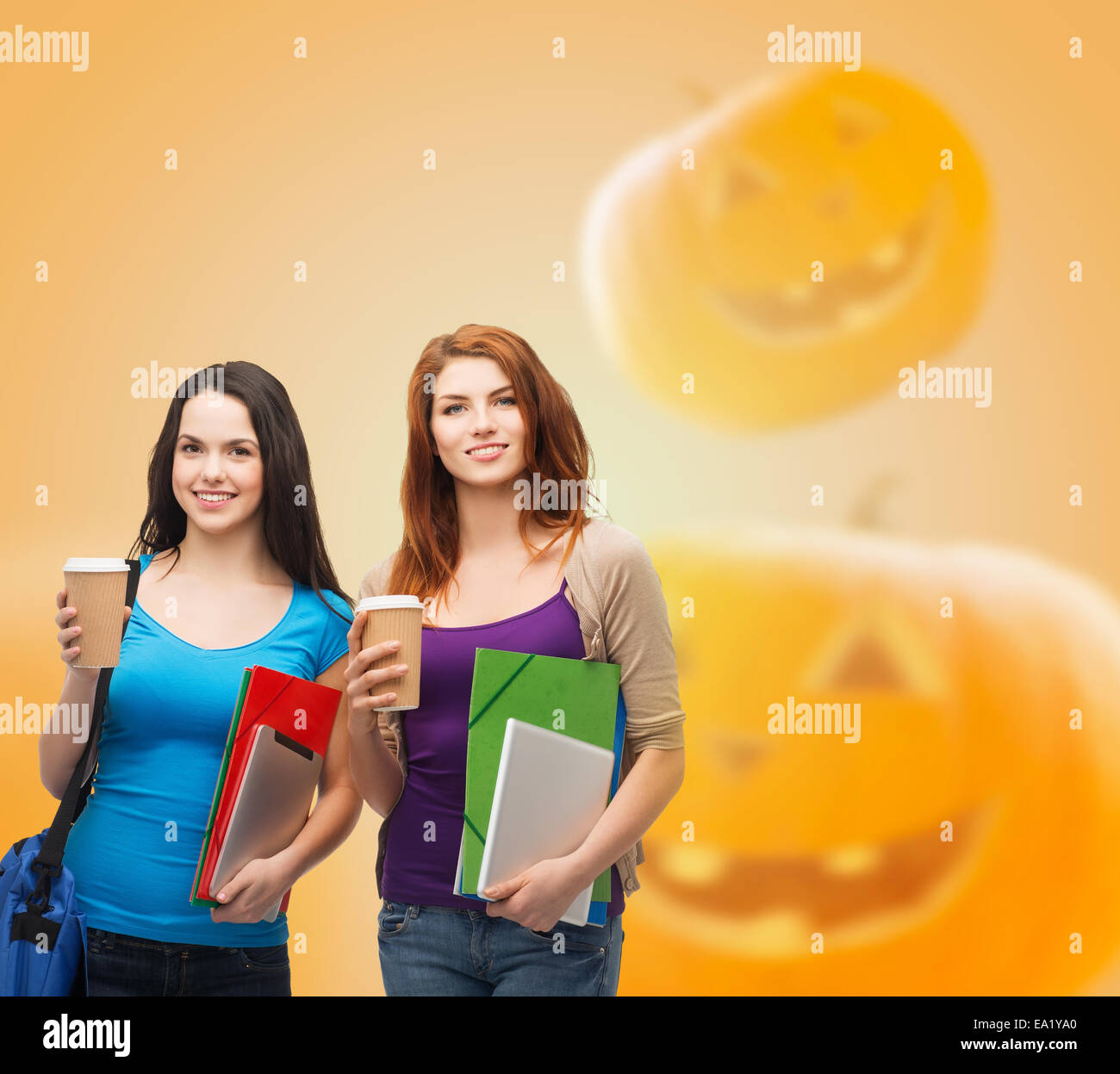 smiling student girls with books and paper cups Stock Photo - Alamy