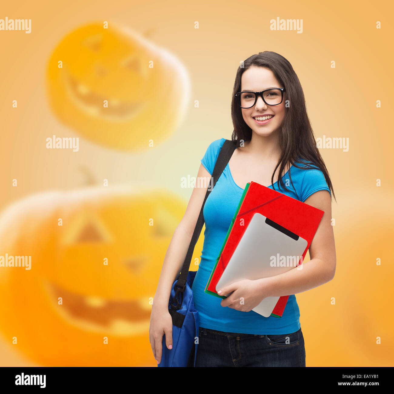 smiling student girl with books and bag Stock Photo
