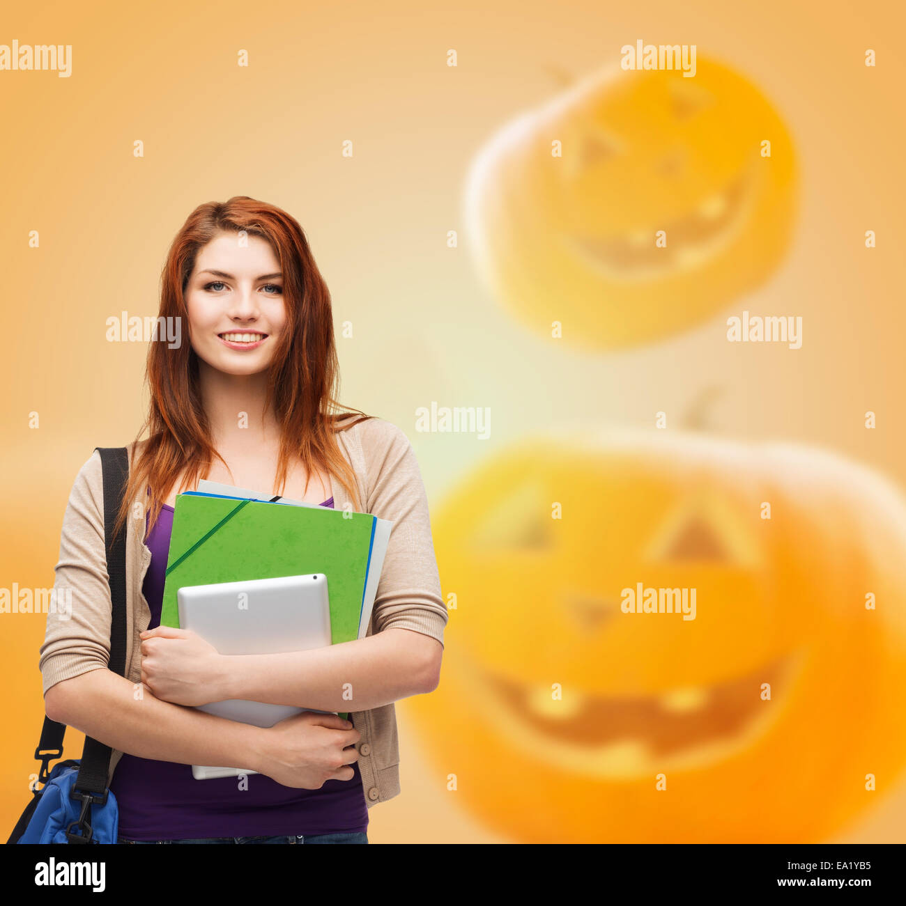 smiling student girl with books and bag Stock Photo