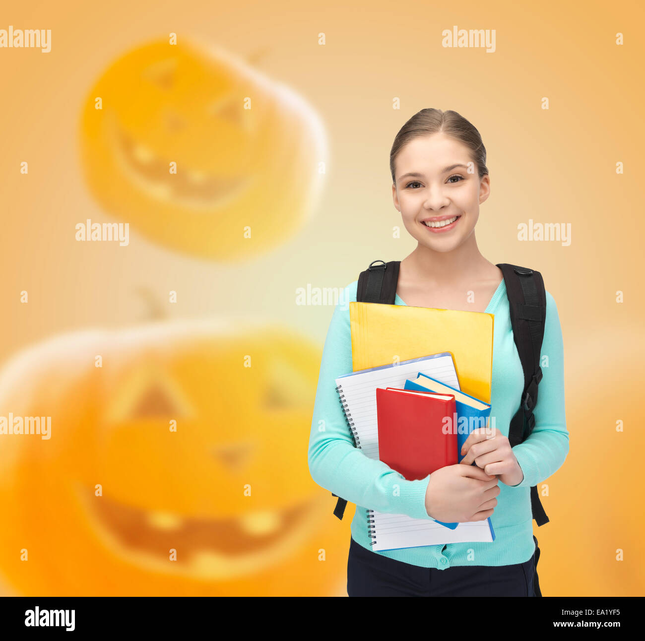 smiling student girl with books and backpack Stock Photo