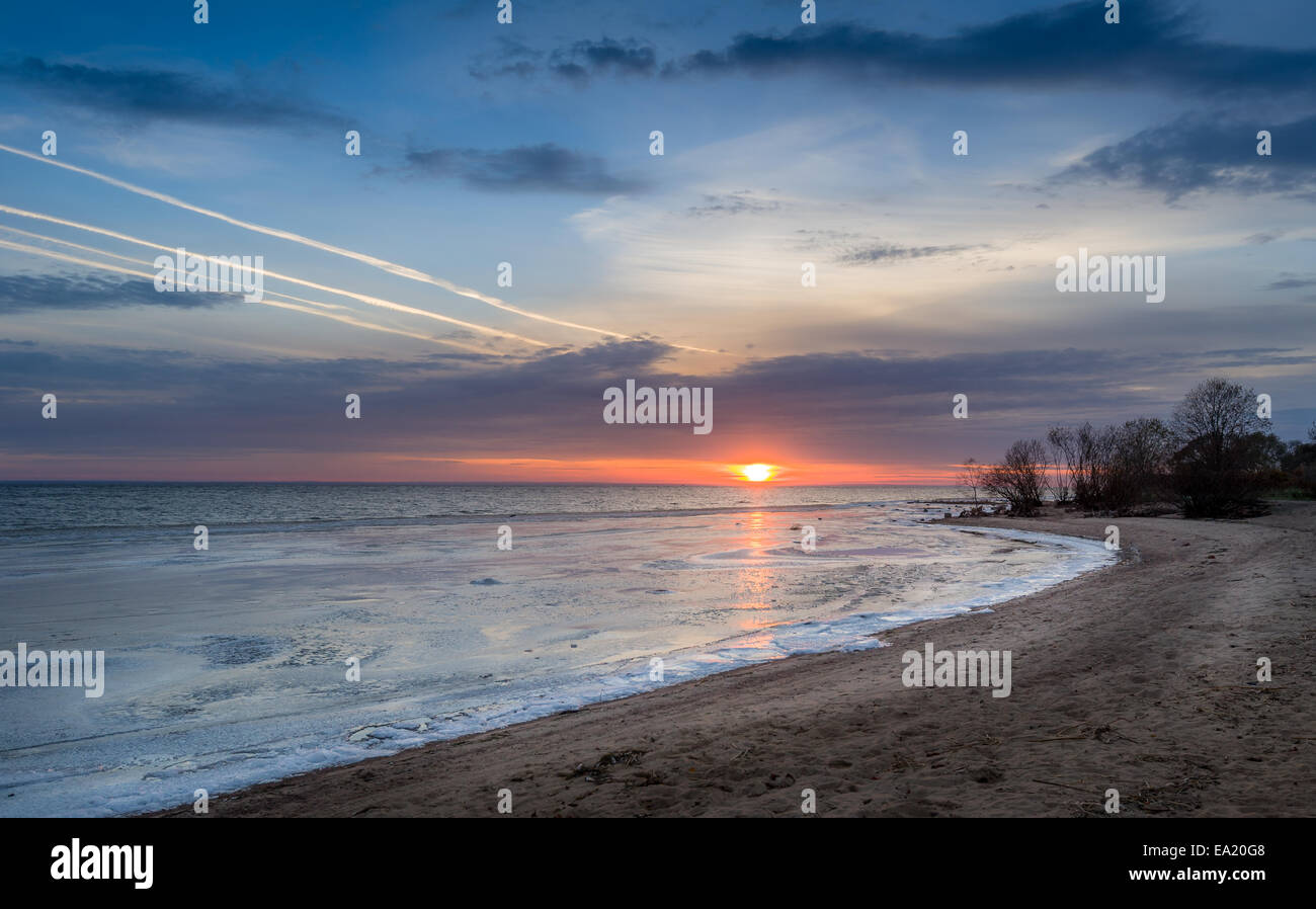 Sunset above frozen sea Stock Photo