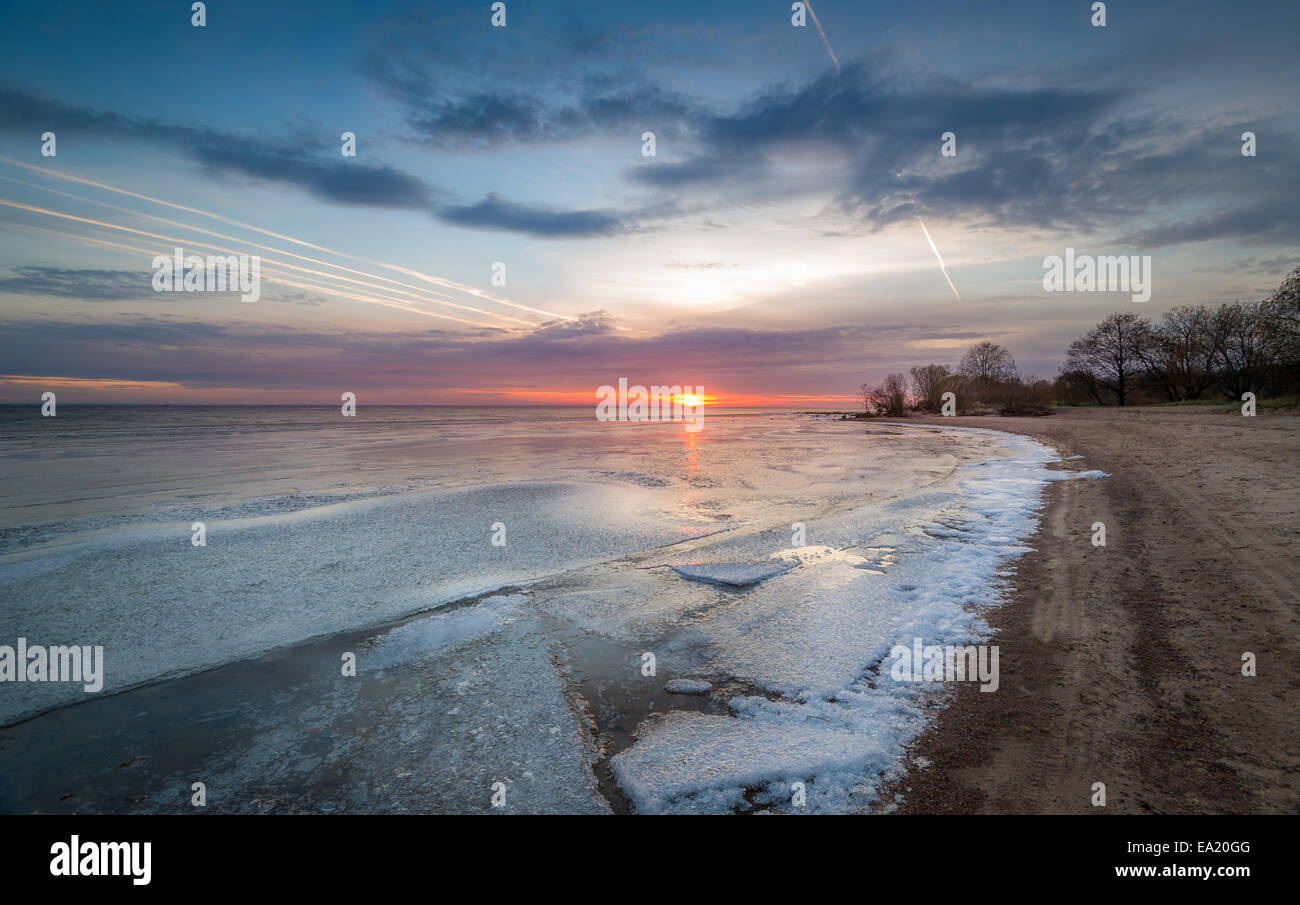 Sunset at frozen bay Stock Photo