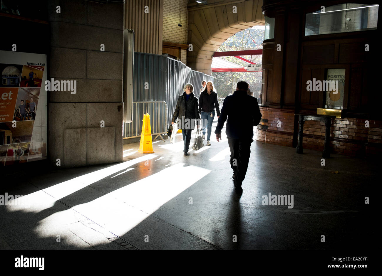 Passengers enter Manchester Victoria train station Stock Photo