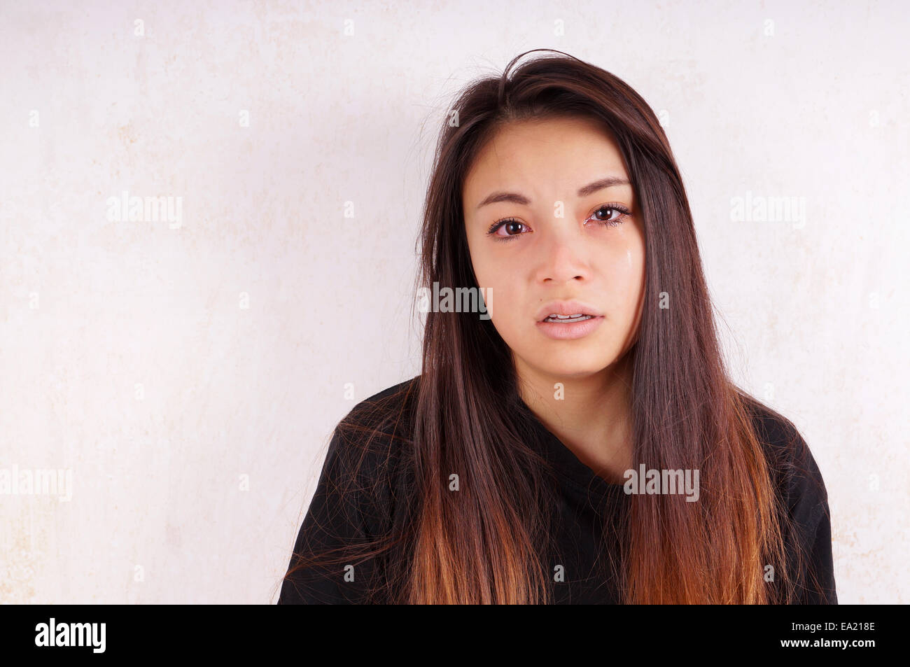 crying young asian woman with tears running down her cheeks Stock Photo ...