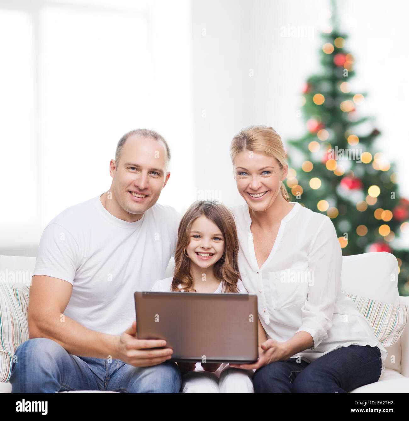 happy family with laptop computer Stock Photo - Alamy