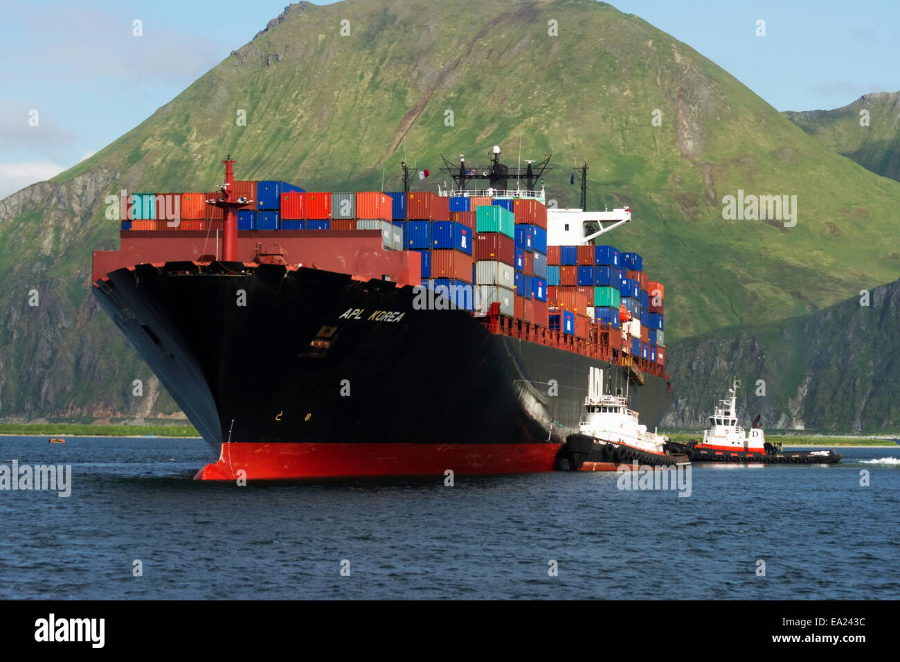 Container vessel APL Korea in Unalaska Bay, Unalaska, Alaska Stock Photo