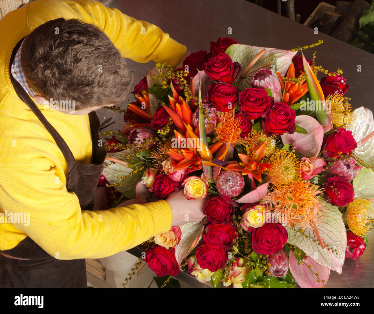 Award winning florist arranging rich 