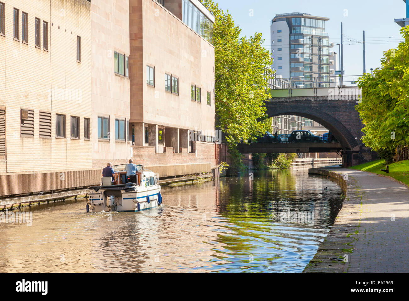 UK city canals. A boat on the Nottingham and Beeston Canal passing through Nottingham, England, UK Stock Photo
