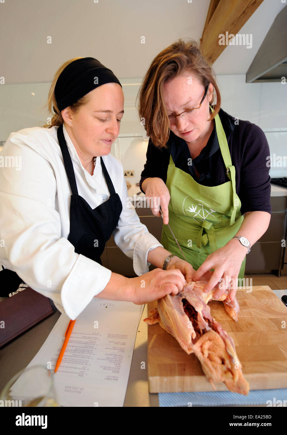 Learning how to chop up a chicken during a cookery course at Thyme at ...