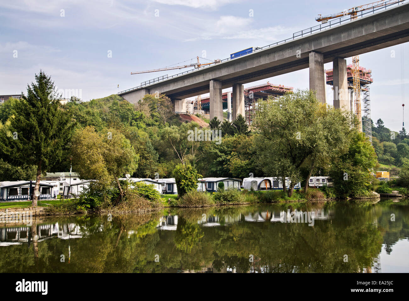 Campground at the Lahn with the old Lahn bridge and the new bridge in the background. Stock Photo
