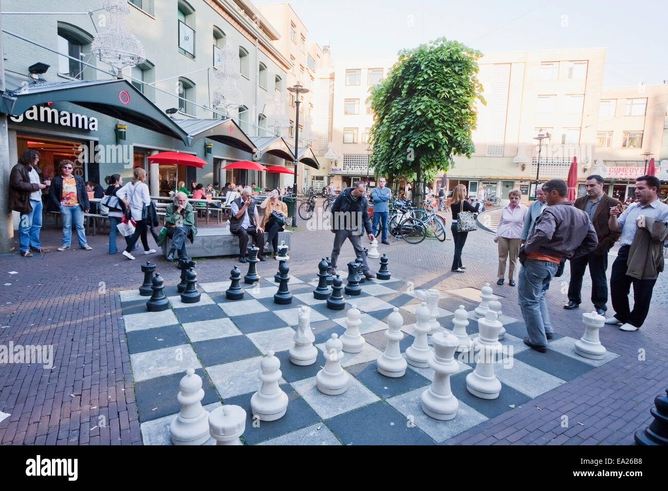 People Playing With A Giant Chess Set On A Square Amsterdam