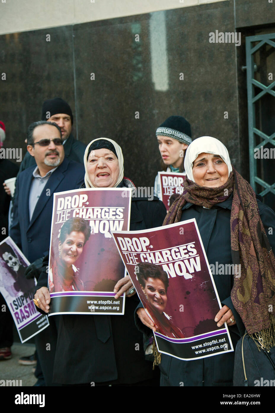 Detroit,  Michigan, USA. 5th November, 2014. Supporters of Palestinian-American activist Rasmea Odeh hold a vigil outside the Federal Courthouse as a trial begins that could imprison her for 10 years and revoke her U.S. citizenship. The government charges that Odeh lied on her 2004 citizenship application by not disclosing that in 1969 she had been imprisoned and tortured by the Israeli military. Credit:  Jim West/Alamy Live News Stock Photo