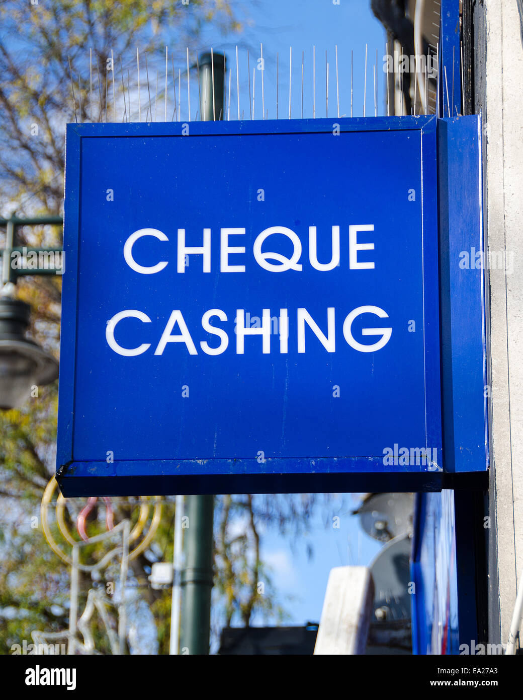 Blue cheque cashing sign Stock Photo