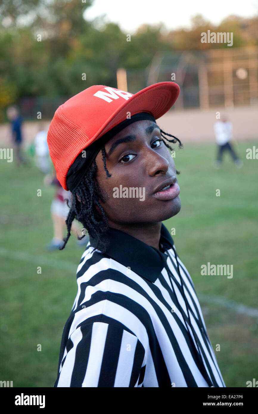 Colorful African American teen referee at a boys soccer match. St Paul Minnesota MN USA Stock Photo