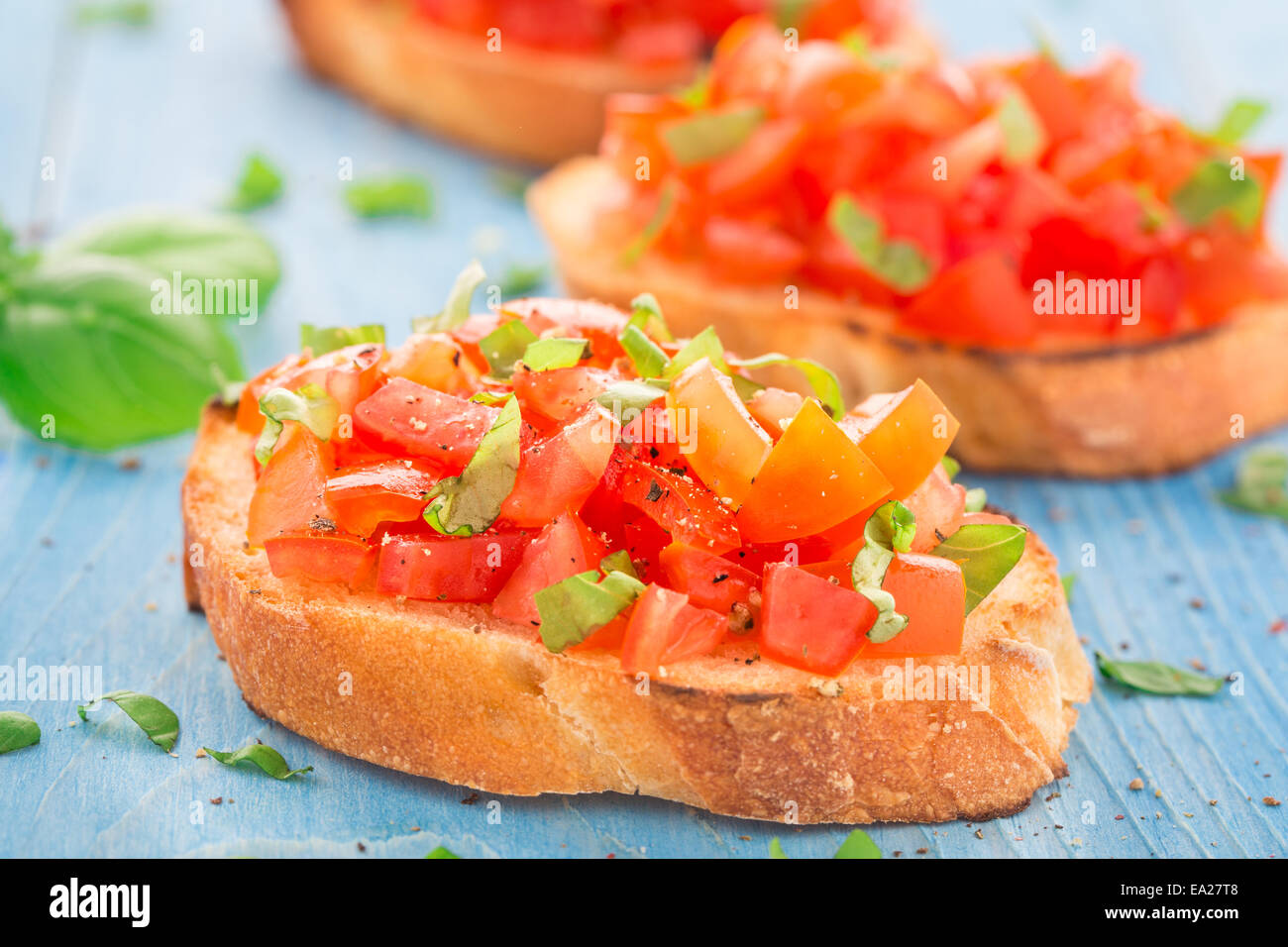 Italian tomato bruschetta with basil Stock Photo - Alamy