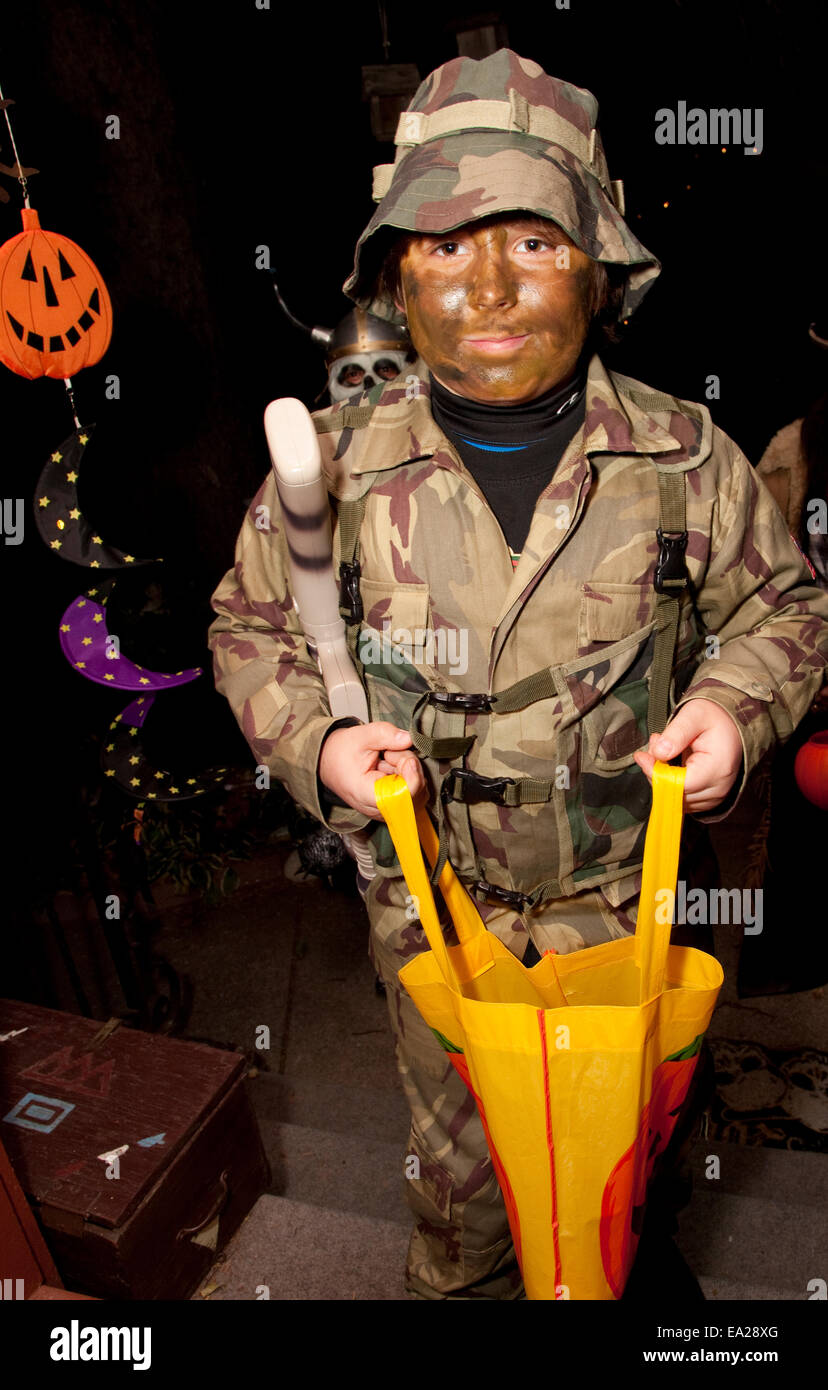 Halloween trick or treater dressed in a military fatigue costume. St Paul Minnesota MN USA Stock Photo