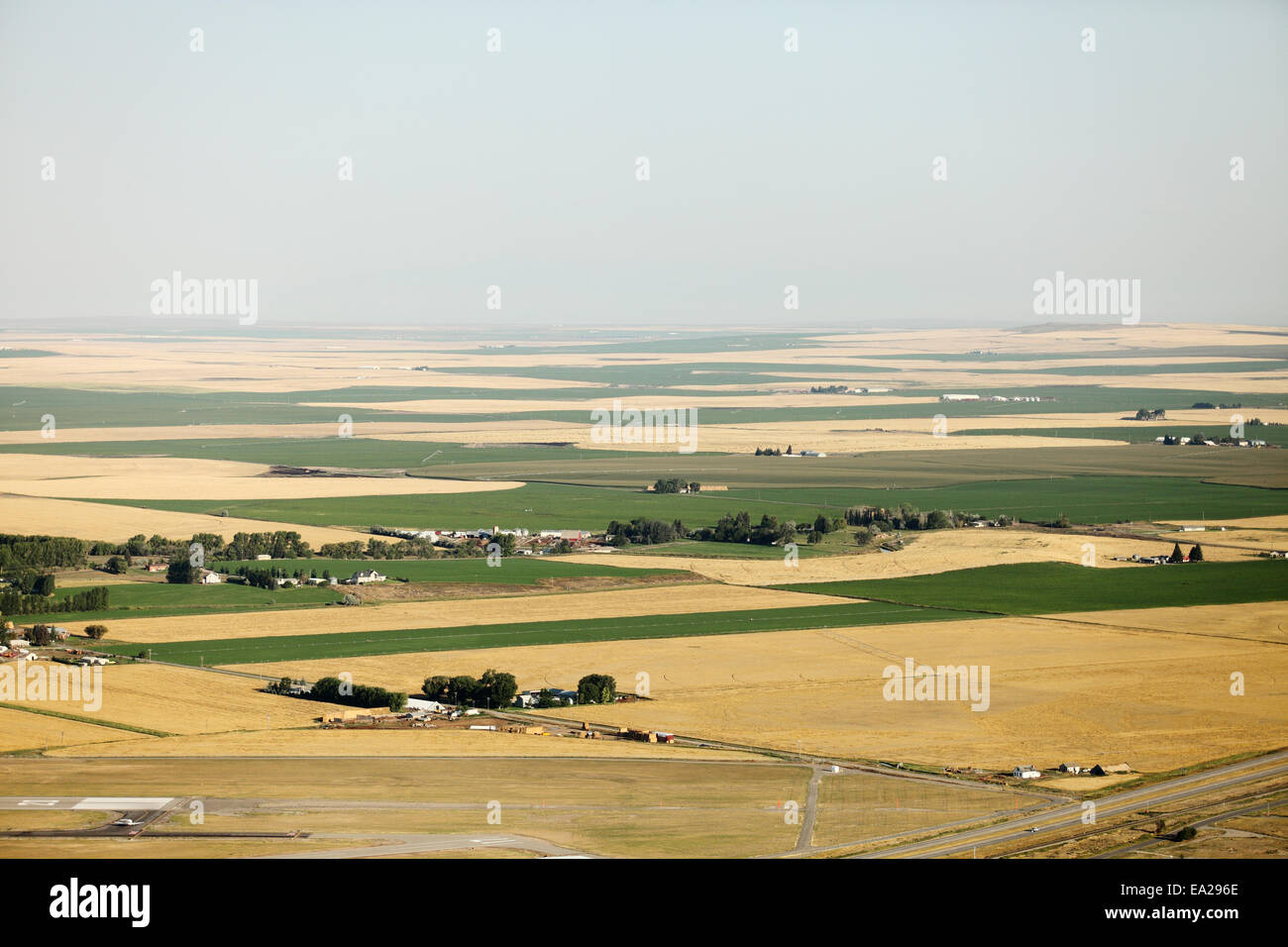 An aerial view of farmland with center pivot sprinklers and other agricultural irrigation methods. Stock Photo
