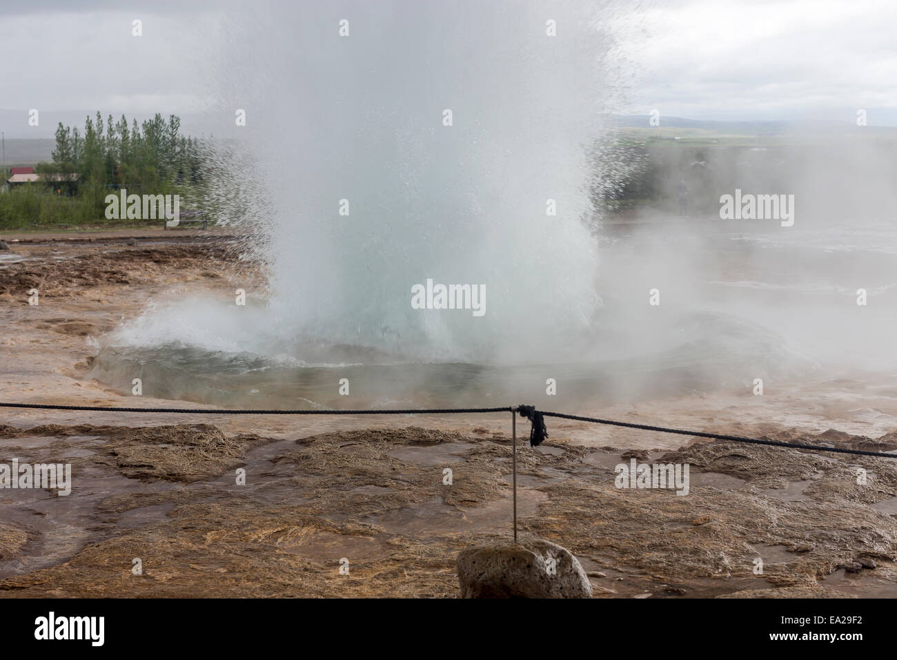 Strokkur Icelandic for 'The Churn' is a geyser in the geothermic region beside the Hvítá River in Iceland Stock Photo