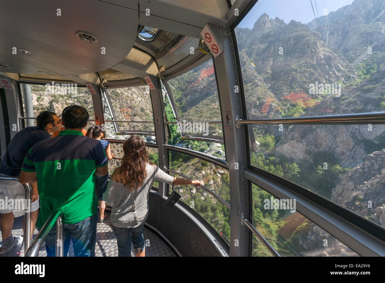 Tourists inside the rotating tram car on the Palm Springs Aerial Tramway, Palm Springs, Riverside County, California, USA Stock Photo