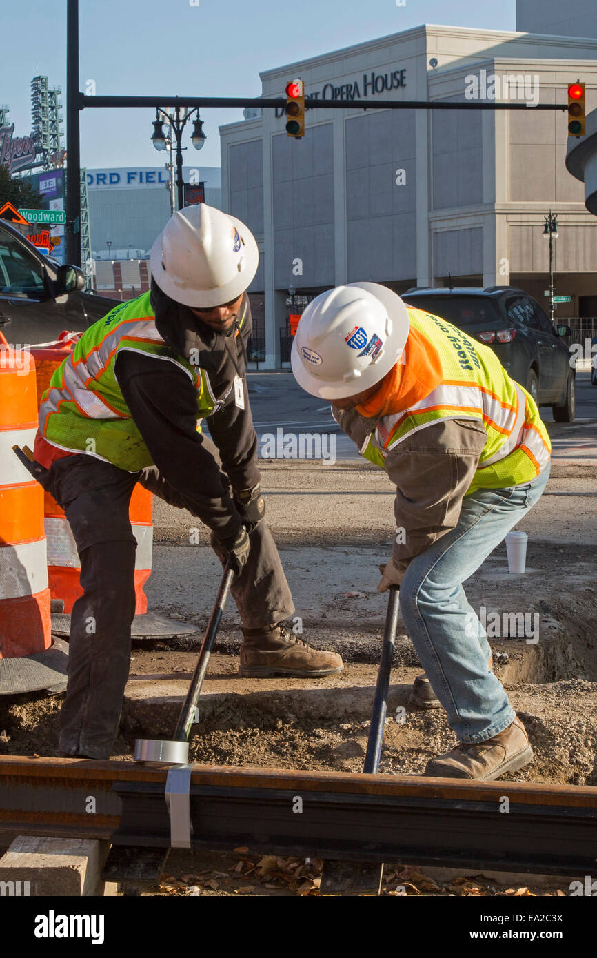 Detroit, Michigan - Workers install rails for 3.3-mile M1 Rail project. Stock Photo