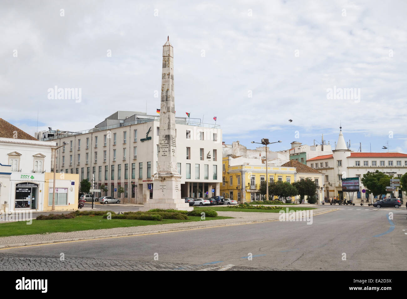 Obelisk memorial at the entrance to Faro Marina in the city of Faro on the Algarve, Portugal. Stock Photo