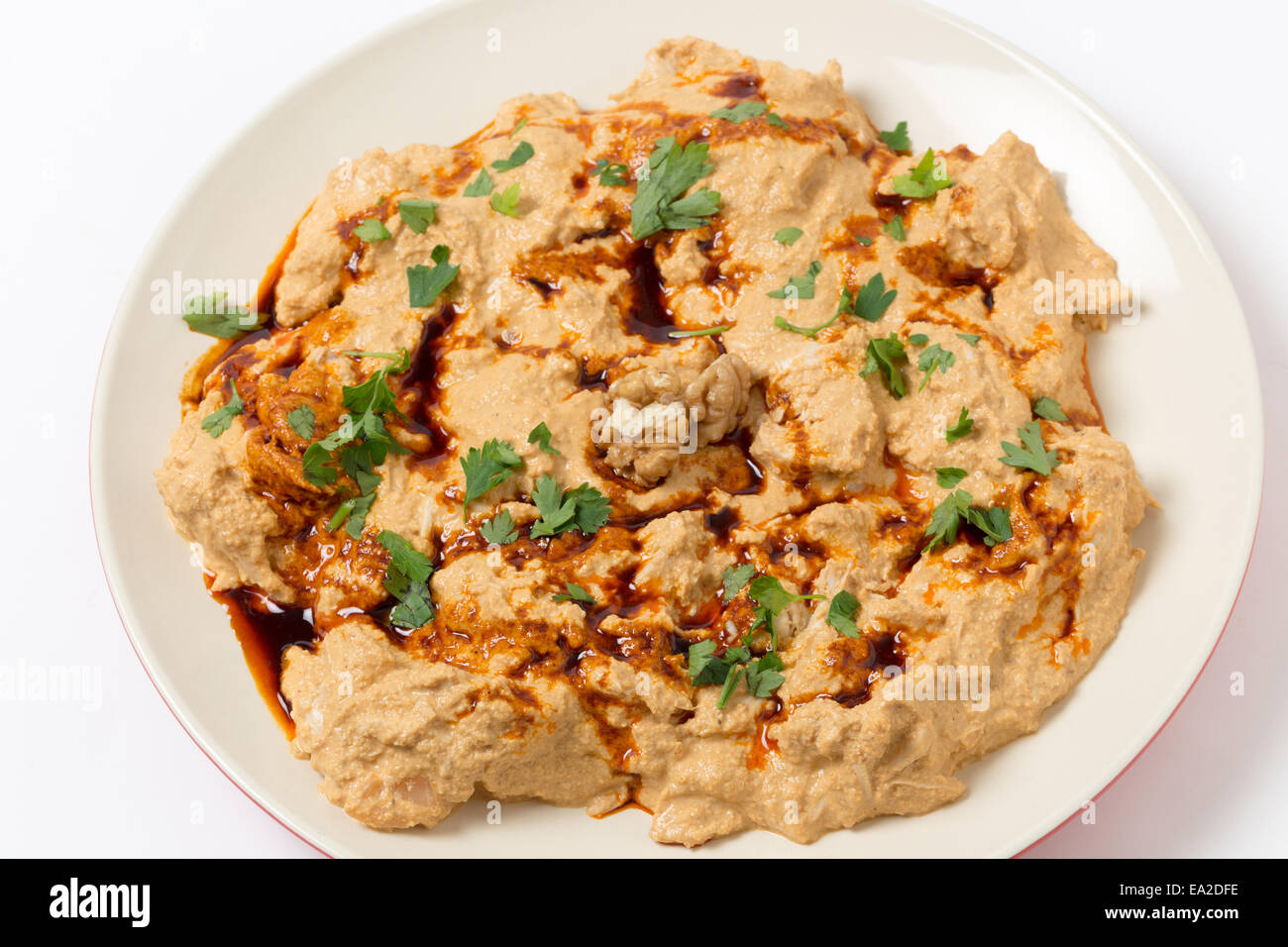 Traditional homemade Ottoman circassian chicken, shredded meat in walnut sauce, drizzled with