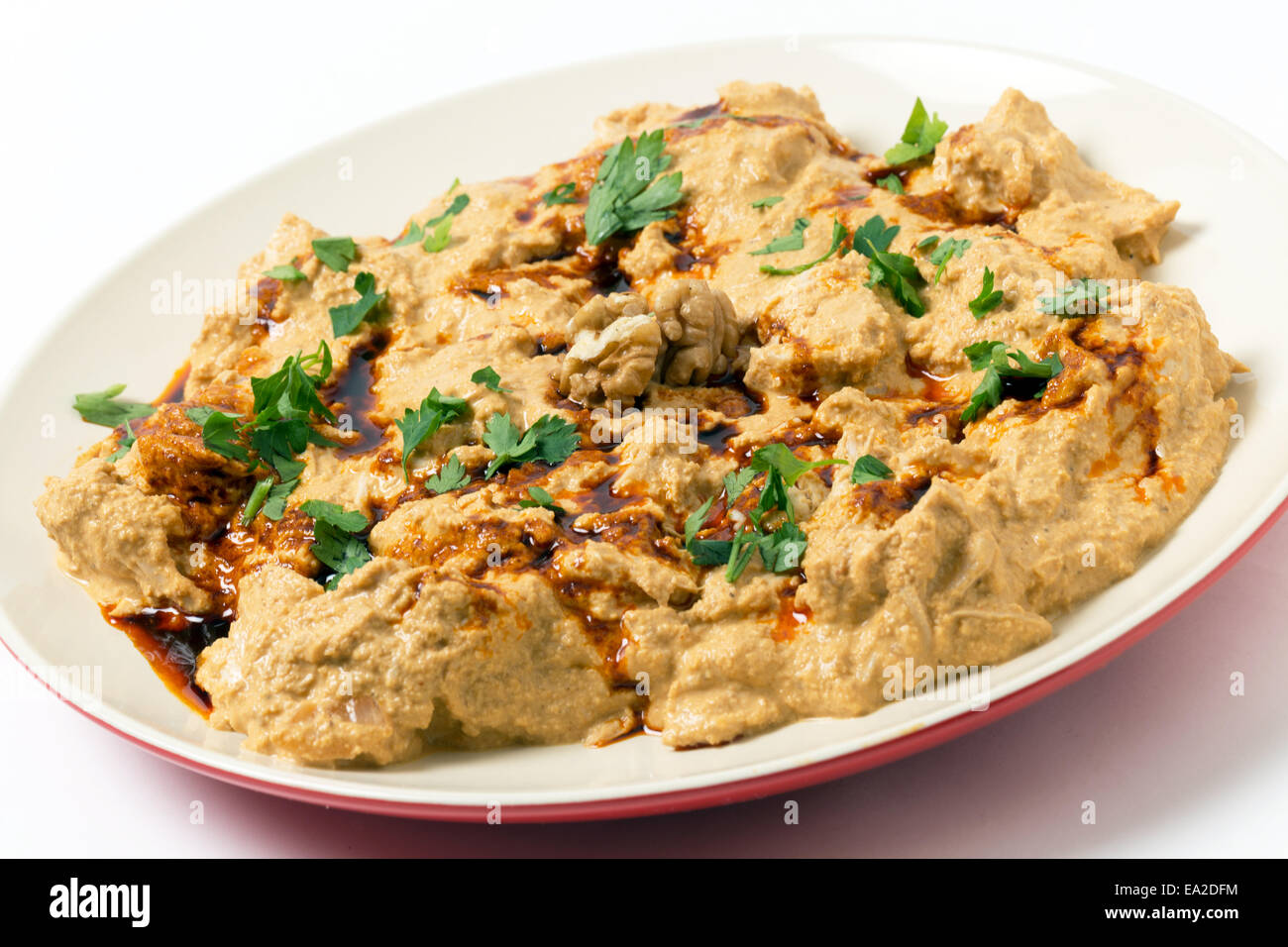 Traditional homemade Ottoman circassian chicken, shredded meat in walnut sauce, drizzled with