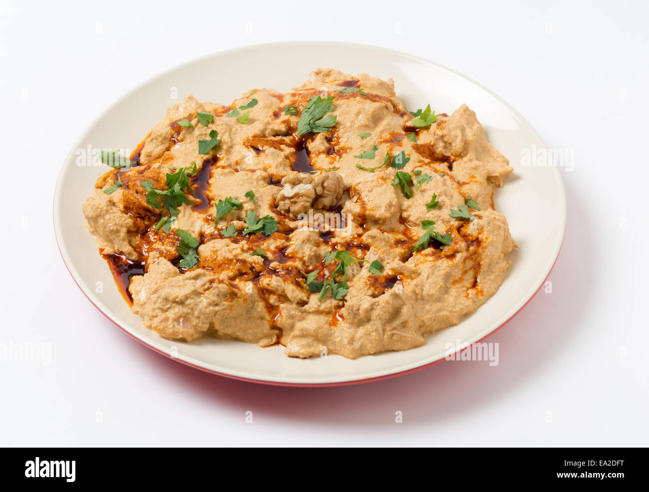 Traditional homemade Ottoman circassian chicken, shredded meat in walnut sauce, drizzled with