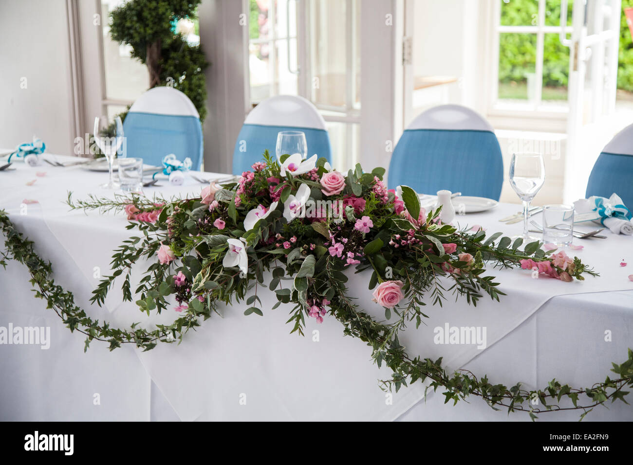 A top table at a wedding day reception decorated with beautiful flowers at a wedding venue in Worcestershire England UK Stock Photo