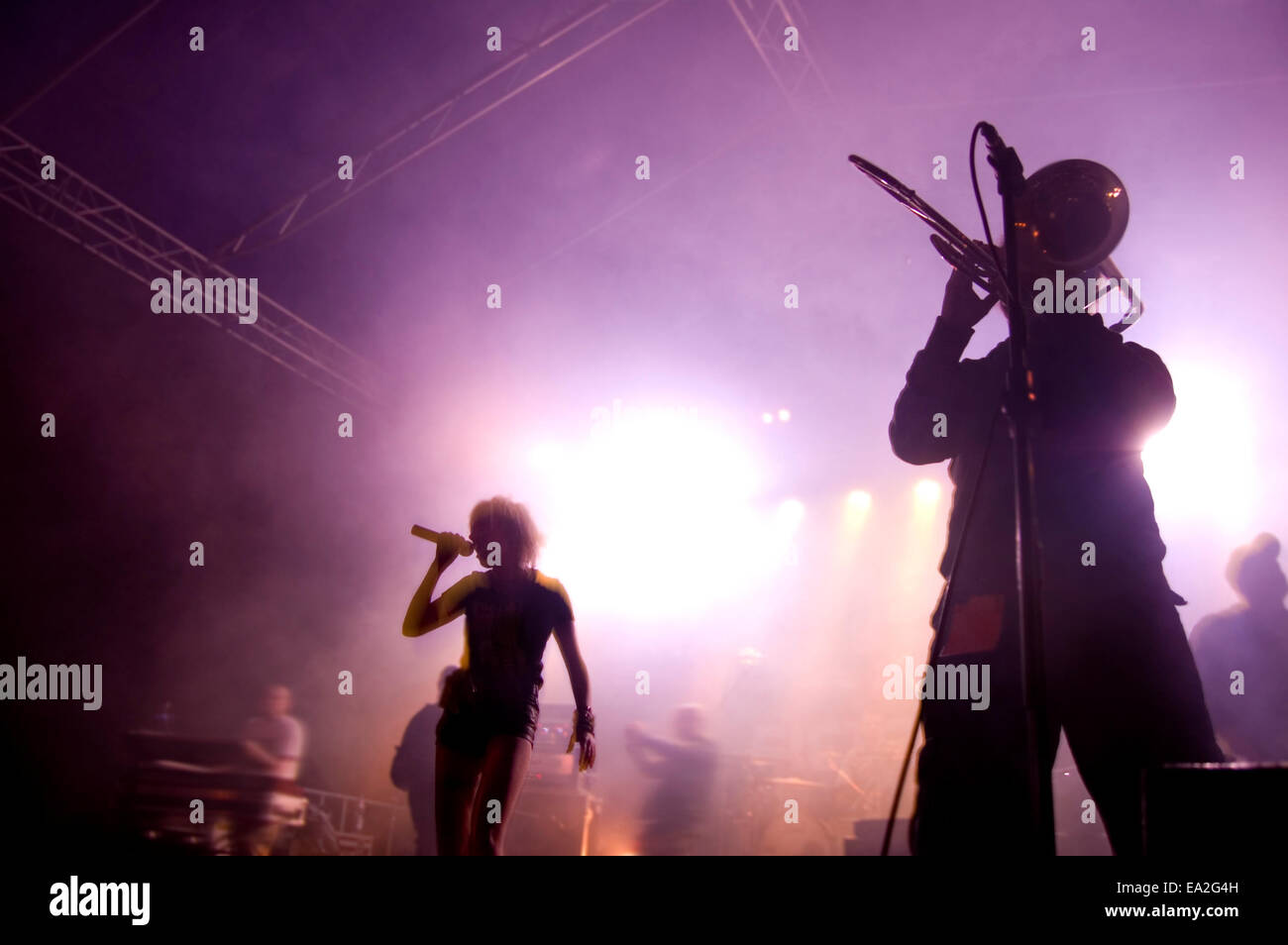 Band on stage at concert. Band performing songs on stage Stock Photo