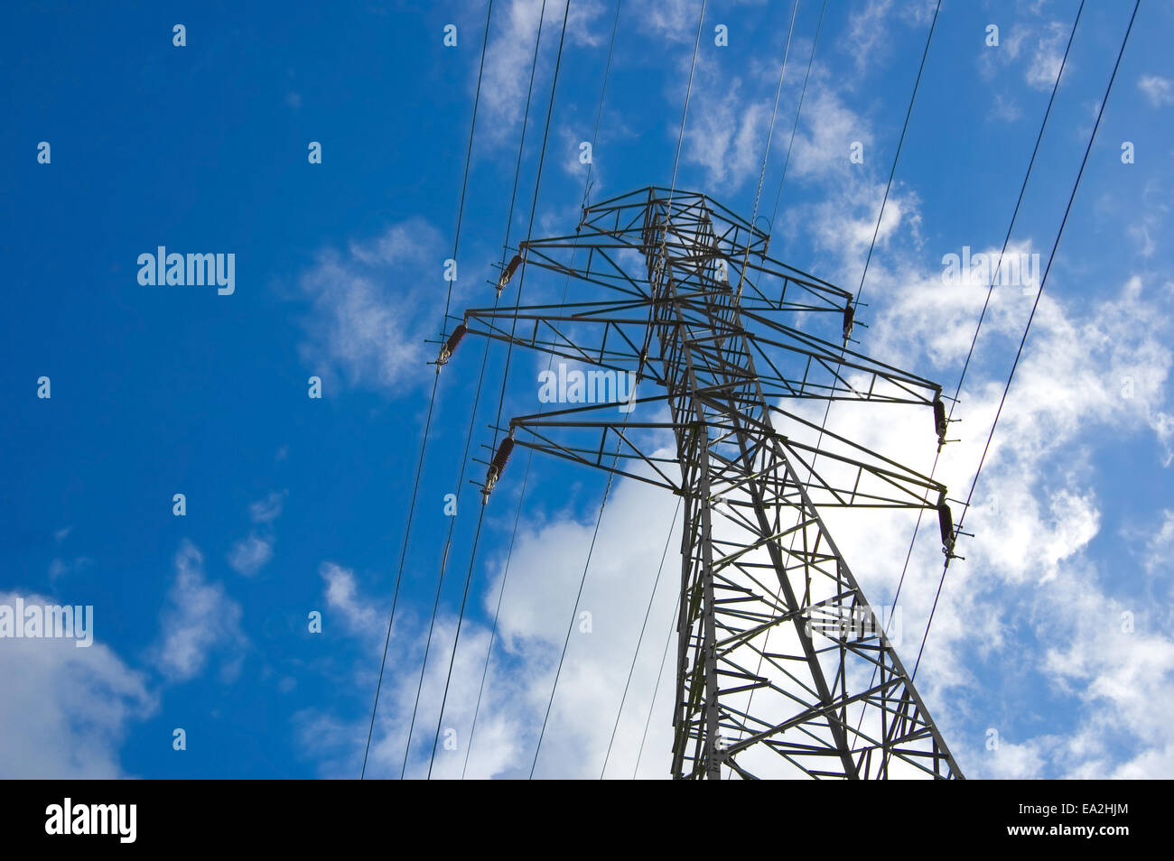 Power lines against the blue sky Stock Photo - Alamy