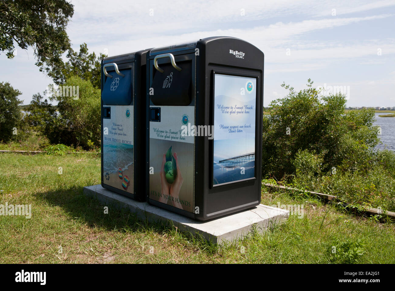 Solar powered combination of a trash can and compacter Stock Photo Alamy