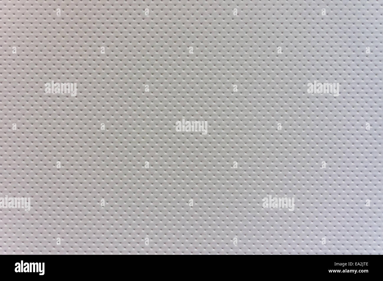 A white leather background with a tiny dot pattern Stock Photo