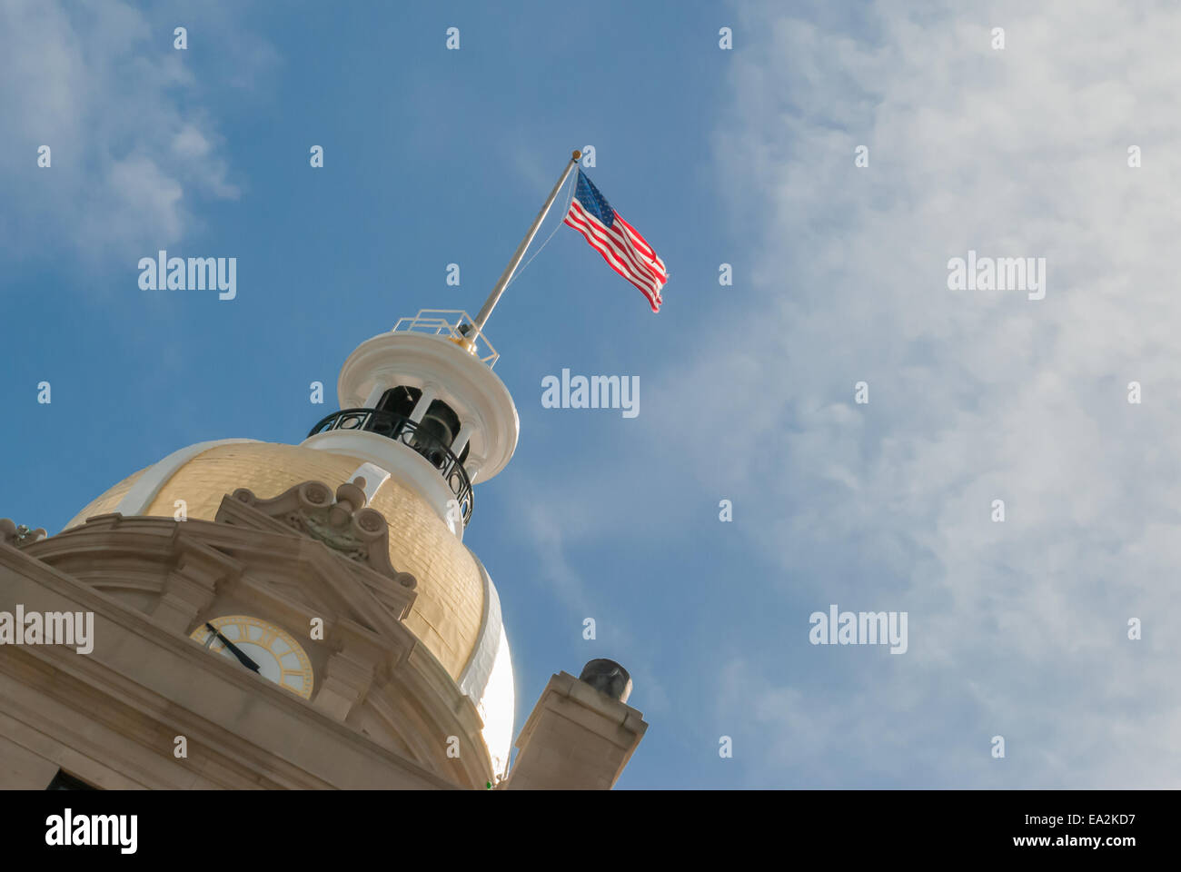 American flag atop a civic building Stock Photo
