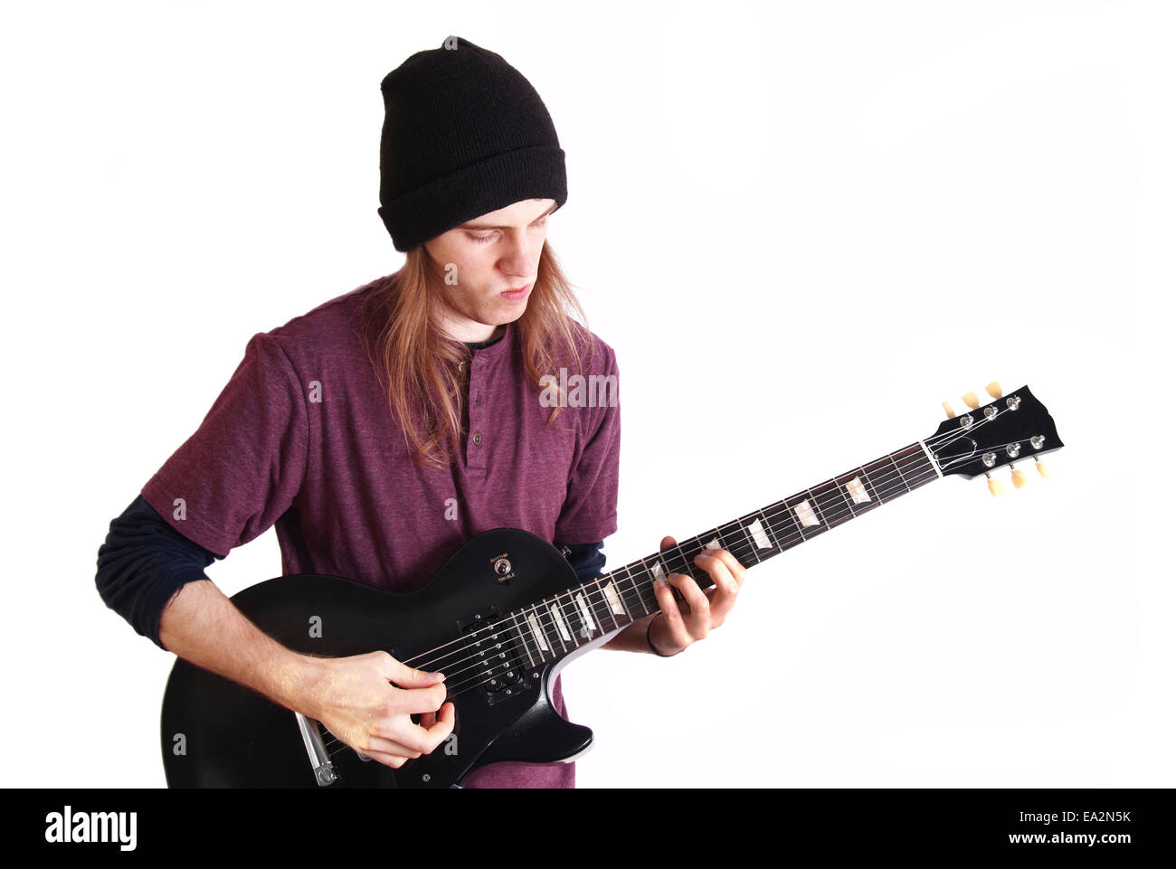 Rock musician. Guitarist play solo on his black guitar. Stock Photo