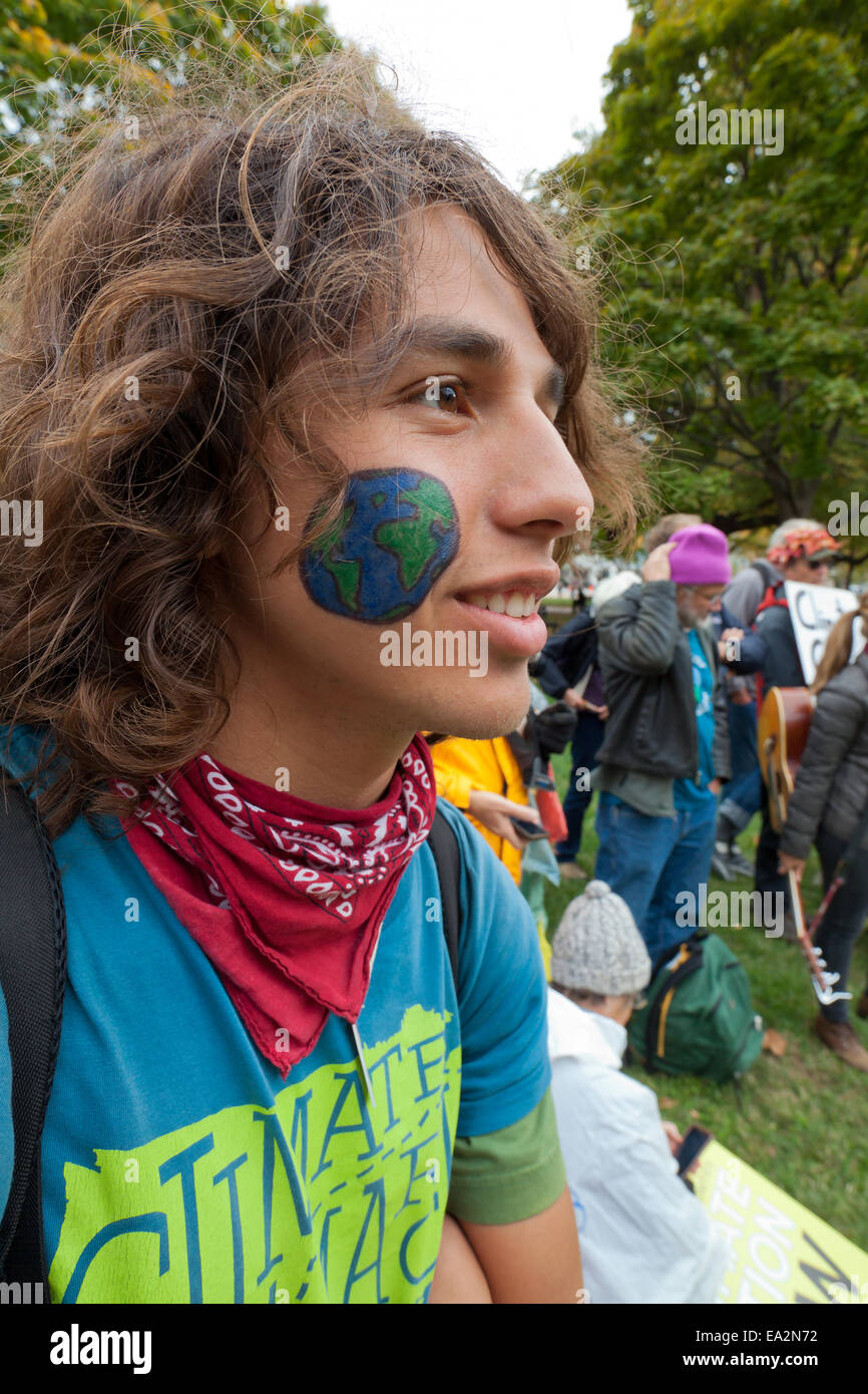 Young climate activist with earth painted on face - Washington, DC USA Stock Photo