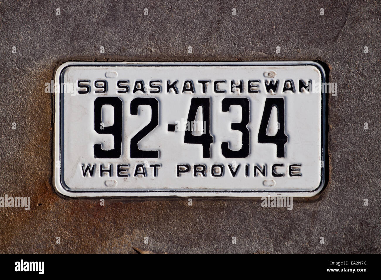 An old, vintage 1959 Province of Saskatchewan (Canada) vehicle license plate as part of an exhibit at River Landing, Saskatoon. Stock Photo